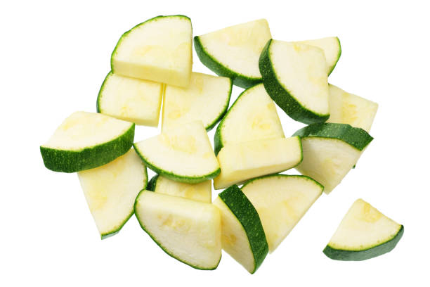 istock fresh green zucchini slices isolated on white background. top view 1216578673