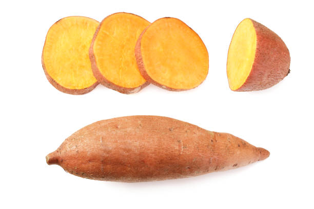 istock Sweet potatoes with slices isolated on a white background 1216578696