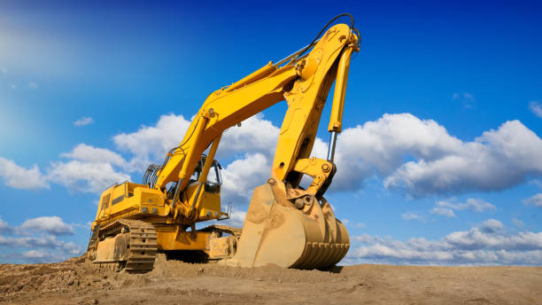 istock Big excavator in front of the blue sky 1216580181