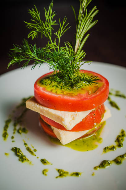 caprese with tomatoes caprese with tomatoes, mozzarella and basil_00 Relish stock pictures, royalty-free photos & images