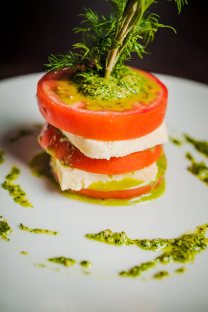 caprese with tomatoes caprese with tomatoes, mozzarella and basil_00 Relish stock pictures, royalty-free photos & images