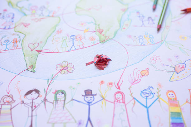 istock Close-up drawing of different nations holding hands 1216583427