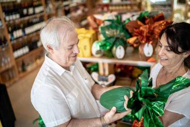 istock Senior couple buying easter egg in a store 1216589217