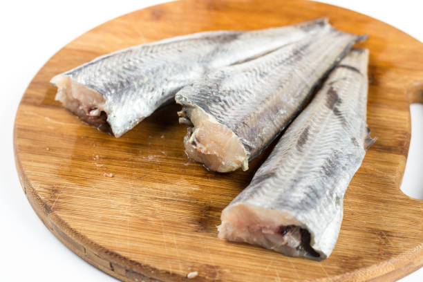 istock Fresh hake fish on the wooden board 1216589507