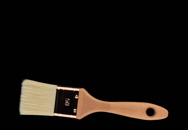 istock A new paintbrush on a black background. 1216589882