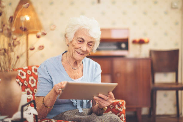 istock Senior woman calculating finances in her kitchen 1216593274