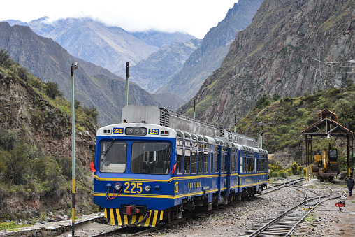 A Peru Rail Expedition train travels through the Urubamba Valley between Ollantaytambo to Machu Picchu. Cusco, Peru
