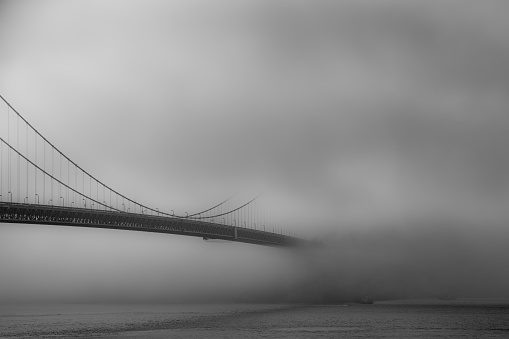Golden gate bridge emerging from the fog