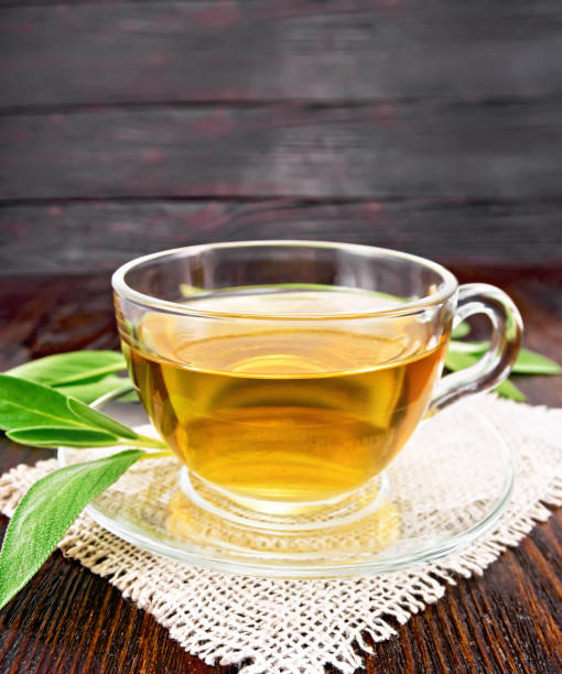 istock Tea herbal with sage in glass cup on wooden board 1216595384