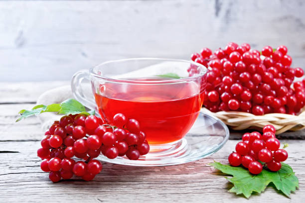 istock Tea from viburnum in cup on board 1216595608