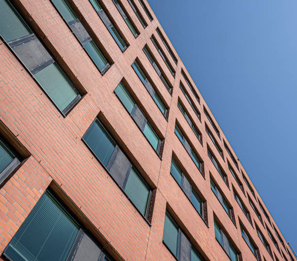 istock brick facade of a corporate building under a blue sky 1216595633