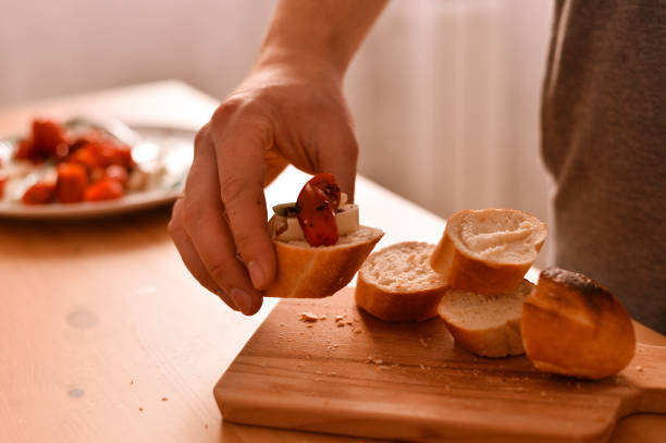 istock A sandwich with fresh bread, cheese and tomatoes 1216596322