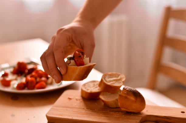 istock A sandwich with fresh bread, cheese and tomatoes 1216596352
