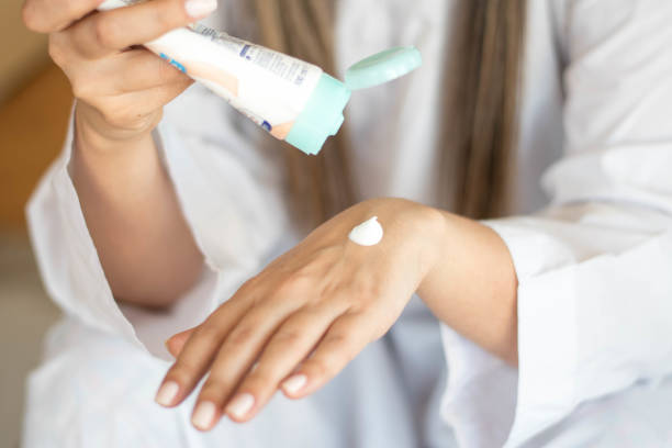 istock Beautiful woman hands with cream 1216596868