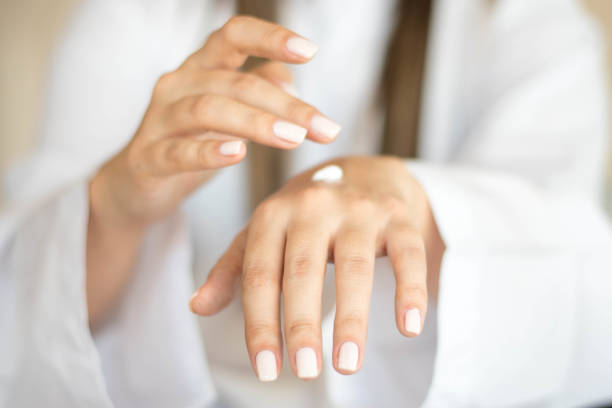 istock Beautiful woman hands with cream 1216596874