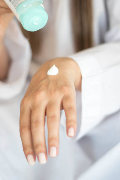 istock Beautiful woman hands with cream 1216596889