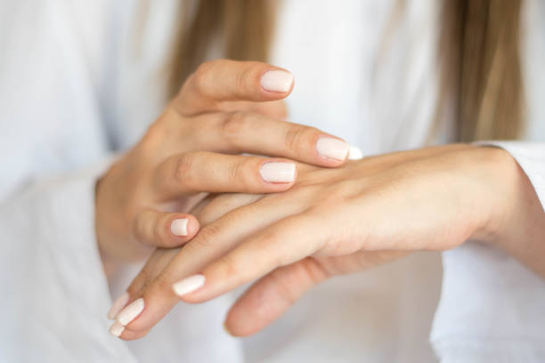 istock Beautiful woman hands with cream 1216596911