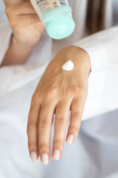 istock Beautiful woman hands with cream 1216596912