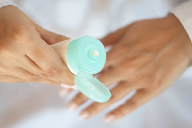 Beautiful woman hands with cream. Protection against dry hands.