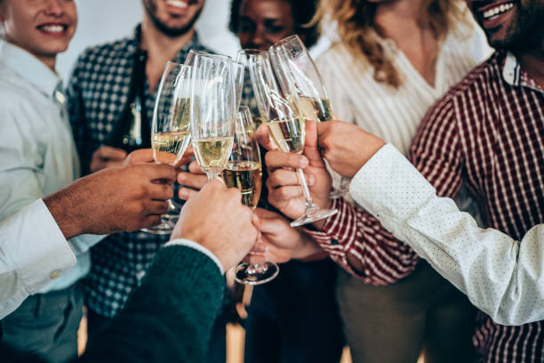 istock Colleagues toasting with champagne on a party. 1216597710
