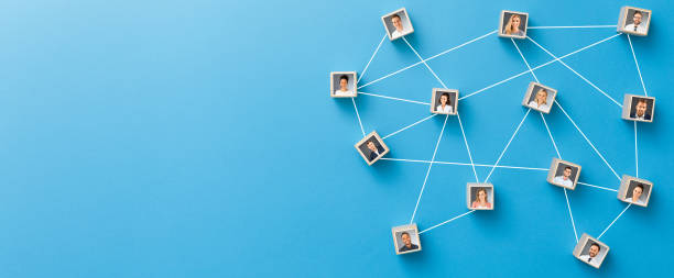 Teamwork, network and community concept. Wooden blocks connected together on blue background. Teamwork, network and community concept. bandwidth photos stock pictures, royalty-free photos & images
