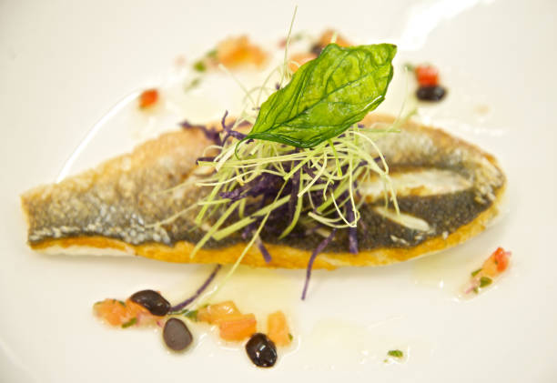istock French Cuisine Fried Sea Bass Fish Dish 1216598731