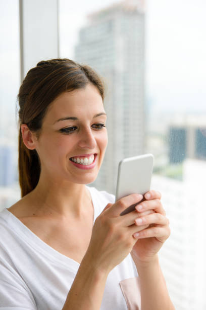 istock Woman texting on smartphone 1216599693