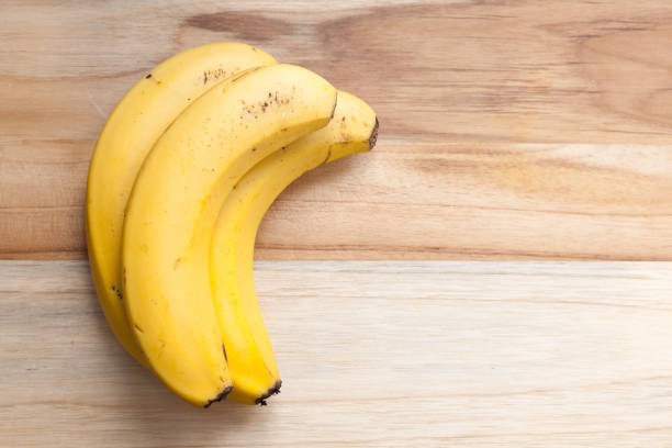 istock banana on a wooden board 1216599806