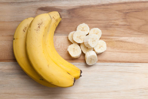 istock sliced banana on a wooden board 1216599816