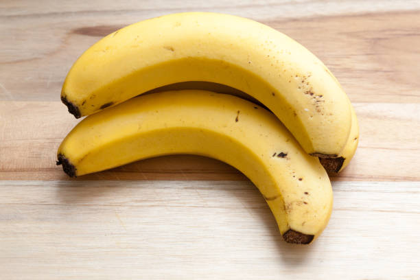 istock banana on a wooden board 1216599844