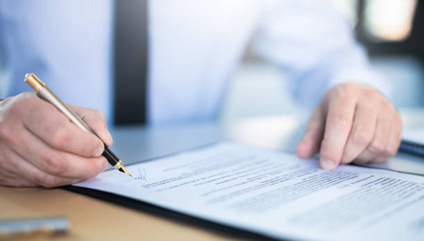 istock Business man signing contract, making a deal. 1216599877