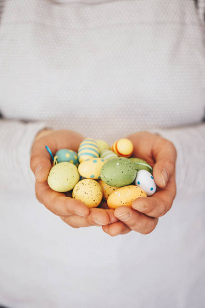 istock Woman holding easter eggs decoration 1216604275