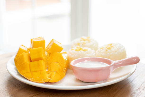 Mango tropical fruit and sticky rice with coconut juice. Thai dessert.