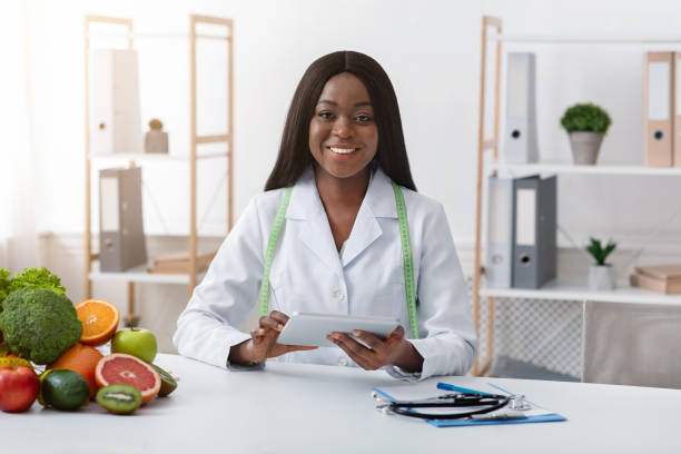 istock Successful dietologist smiling at her modern office 1216604569