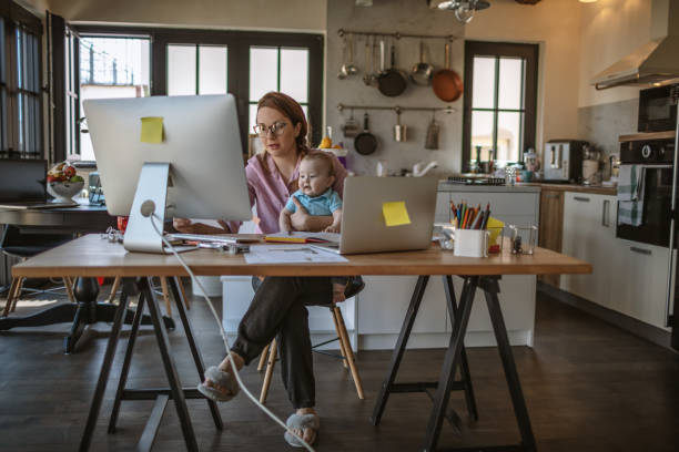 Mother with baby working from Home