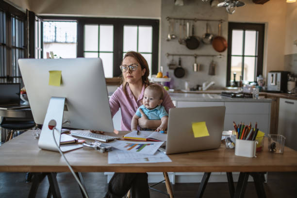 istock Mother with baby working from Home 1216605310