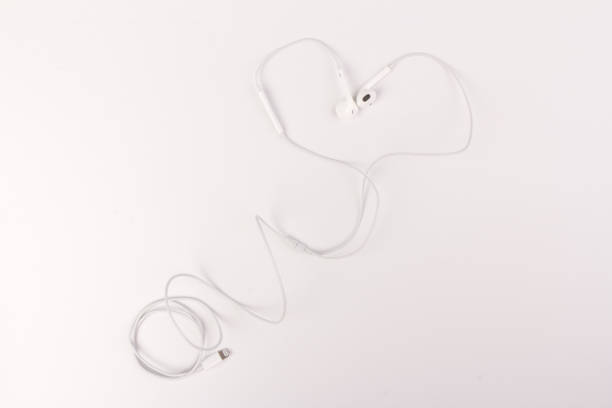 istock White headphones with headset on white isolated background 1216607072