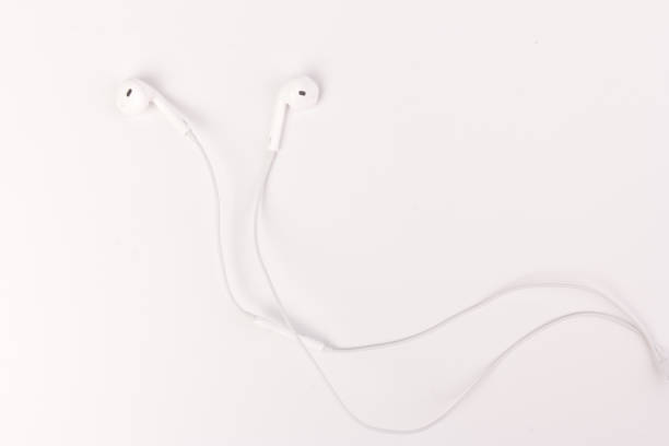 istock White headphones with headset on white isolated background 1216607137