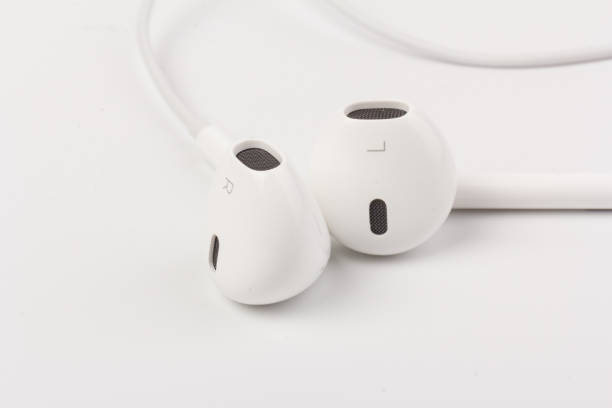 istock White headphones with headset on white isolated background 1216607163