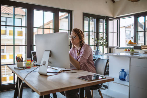 istock Young woman working from home 1216607265