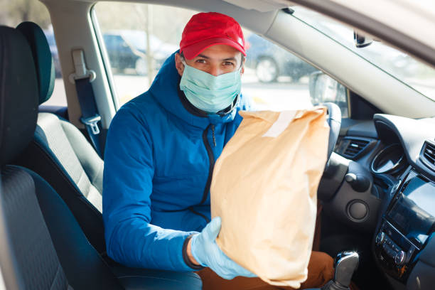 istock Coronavirus Covid-19 infection.masked delivery man, epidemic 1216607920