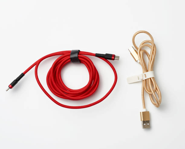 istock twisted cable for charging mobile devices in a red and golden textile wrapper 1216609982