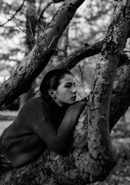 istock Young beautiful woman walking in the forest 1216610800