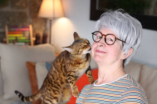 istock Senior woman showing complicity with her pet 1216610870
