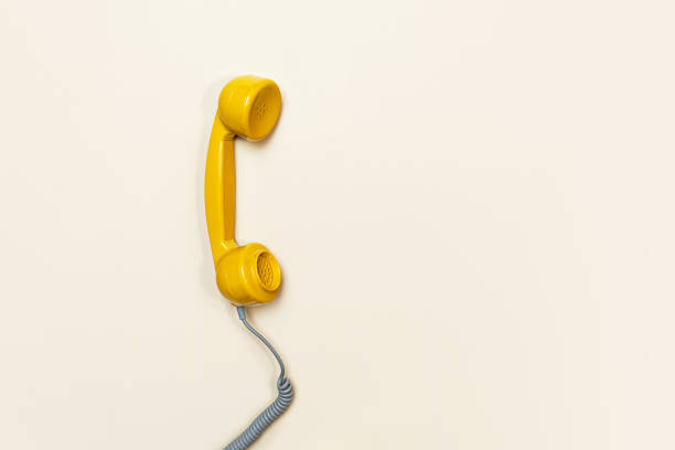 istock Old fashioned handset on beige color background. Modern retro style. 1216611063