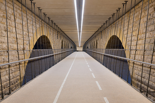 Illuminated cycle track below Pont Adolphe bridge in Luxembourg city