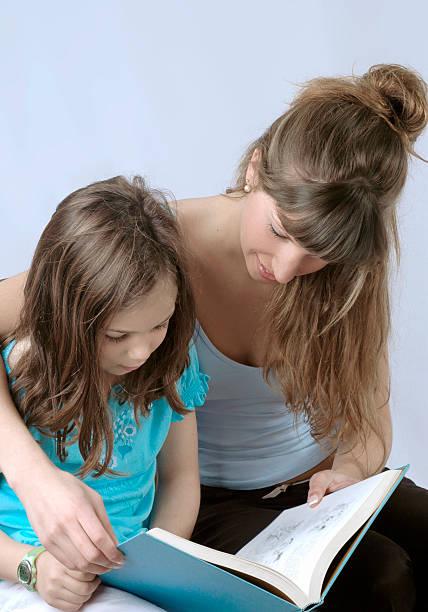 istock Mother and daugther reading 121661576