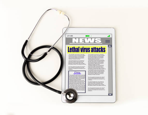 stetoscopio sdraiato sopra un tablet con notizie digitali - newspaper the media reading digital display foto e immagini stock