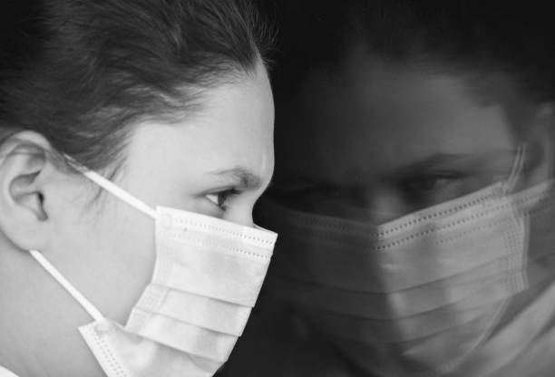 istock Young girl wearing face mask 1216616393