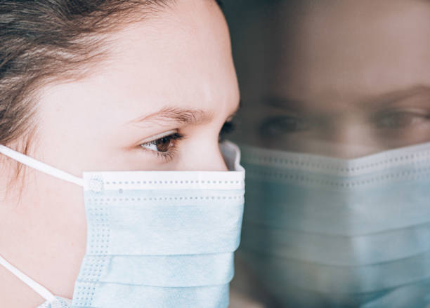 istock Young girl wearing face mask 1216616419